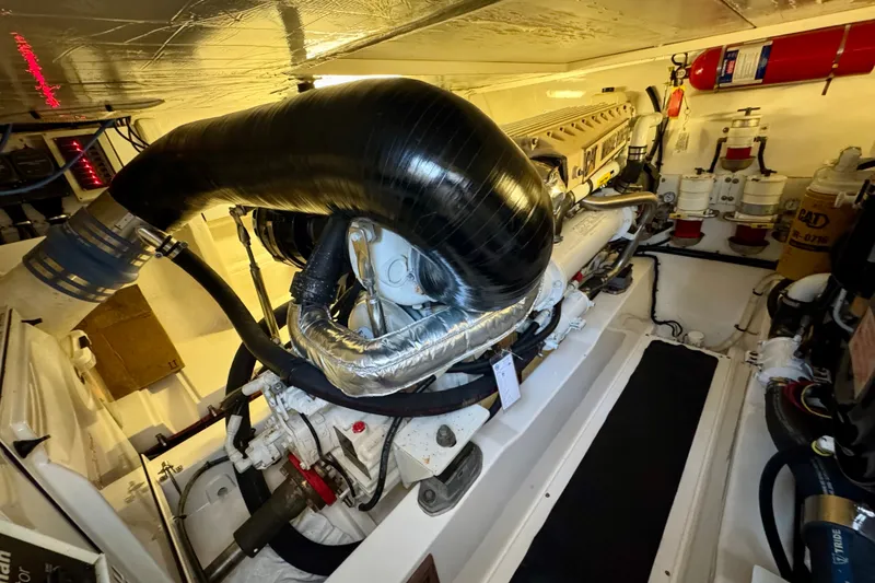 Slide: The Image of Engine room of 2009 Riviera 45 Open Flybridge, showcasing mechanical components and systems. - 59