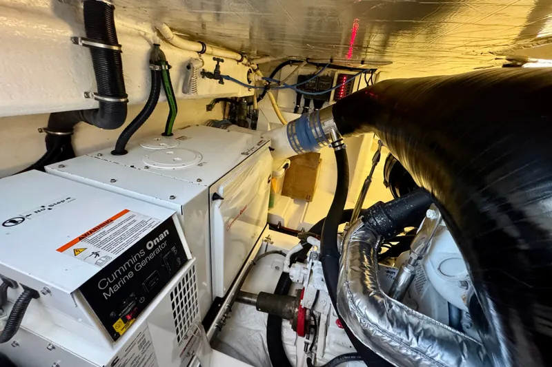 Slide: The Image of Engine room of 2009 Riviera 45 Open Flybridge with Cummins Onan marine generator. - 65