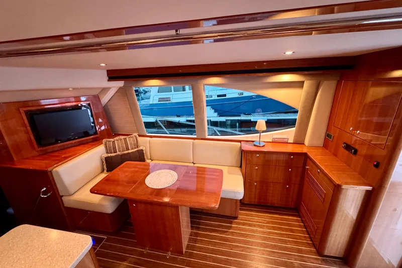 Slide: The Image of Luxurious interior of 2009 Riviera 45 Open Flybridge yacht with elegant wood finishes. - 28