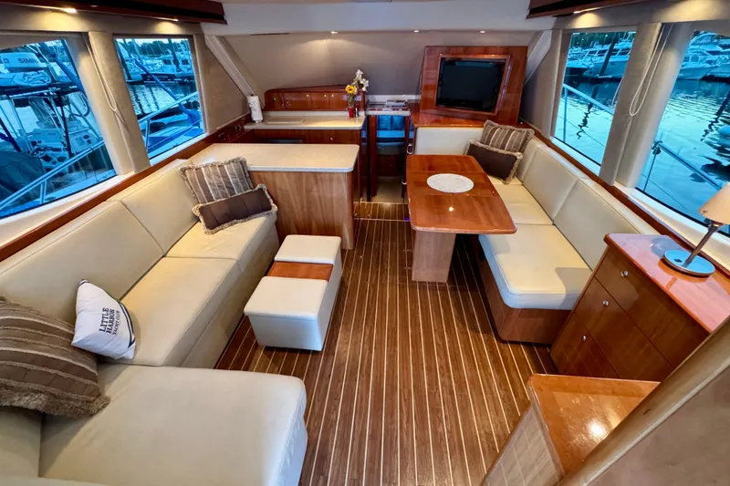 Slide: The Image of Luxurious interior of 2009 Riviera 45 Open Flybridge yacht with elegant seating and wood finishes. - 26
