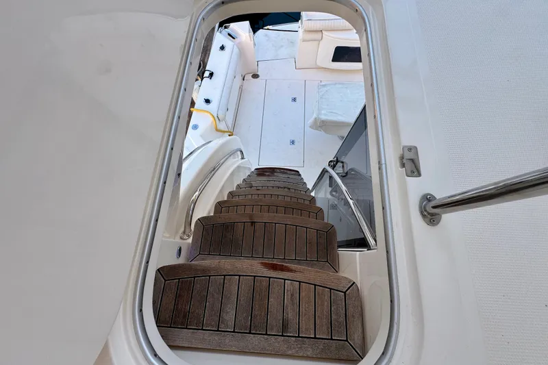 Slide: The Image of Staircase on 2009 Riviera 45 Open Flybridge yacht, leading to deck area. - 17