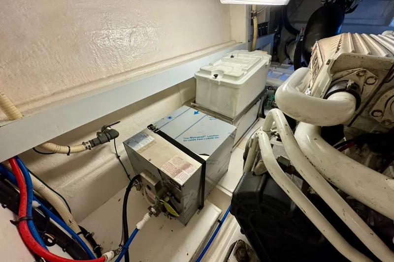 Slide: The Image of Engine room of 2009 Riviera 45 Open Flybridge with mechanical components and wiring. - 64