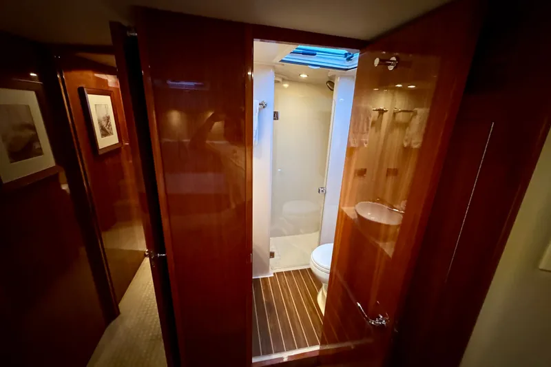 Slide: The Image of Luxurious bathroom interior of 2009 Riviera 45 Open Flybridge yacht with wooden finishes. - 53