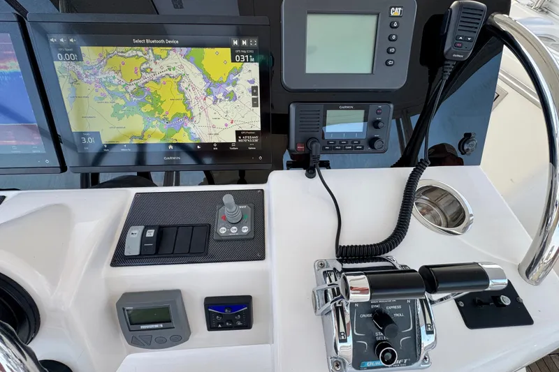 Slide: The Image of Control panel of a 2009 Riviera 45 Open Flybridge with navigation and communication equipment. - 24