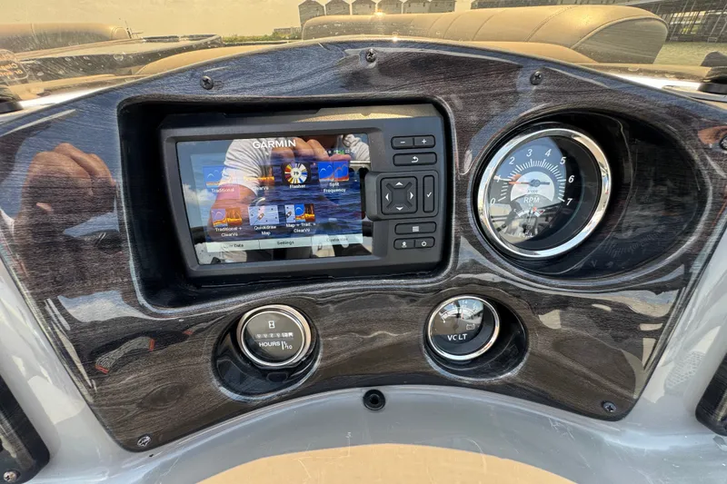 Slide: The Image of Dashboard of 2023 Qwest Lanai 820 with Garmin display and RPM gauge. - 11