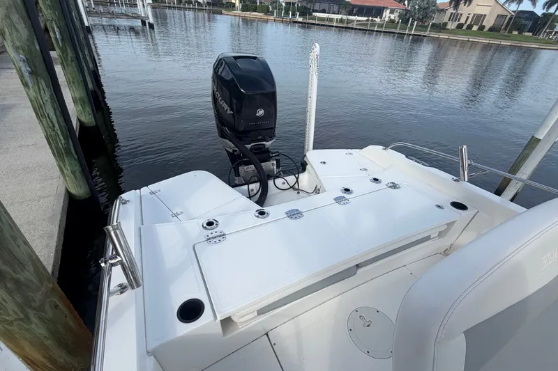Slide: The Image of 2016 Boston Whaler 240 Dauntless boat with Mercury engine docked by waterfront. - 23