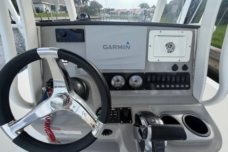 Slide: The Image of Steering console of 2016 Boston Whaler 240 Dauntless with Garmin navigation system. - 20