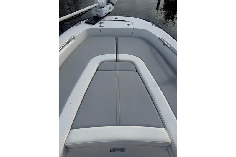 Slide: The Image of 2016 Boston Whaler 240 Dauntless boat interior with cushioned seating. - 7