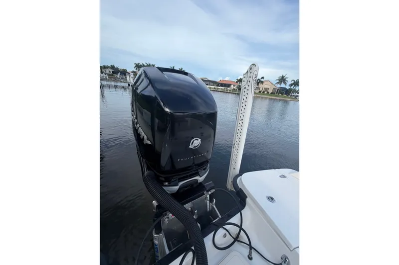 Slide: The Image of 2016 Boston Whaler 240 Dauntless boat with Mercury outboard motor on calm water. - 25