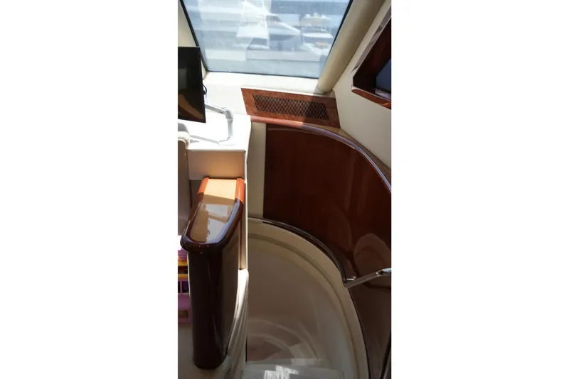 Slide: The Image of Interior staircase of 2008 Marquis 65 Skylounge yacht with polished wood finish. - 50
