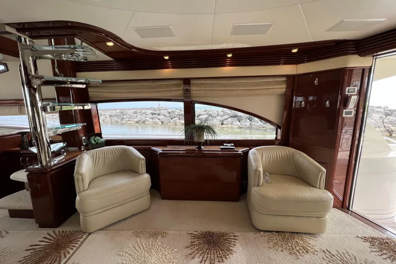 Slide: The Image of Luxurious interior of a 2008 Marquis 65 Skylounge yacht with elegant seating and panoramic windows. - 9