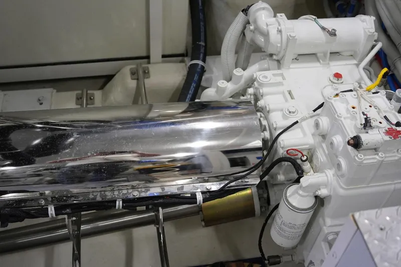 Slide: The Image of Engine compartment of a 2008 Marquis 65 Skylounge yacht, showcasing mechanical components. - 76