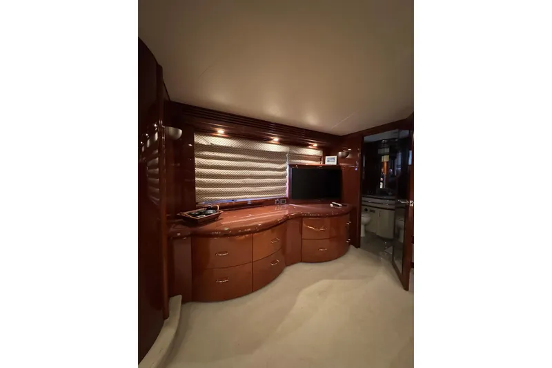 Slide: The Image of Luxurious interior of a 2008 Marquis 65 Skylounge yacht with elegant wood cabinetry. - 61