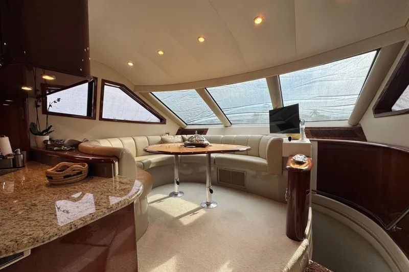 Slide: The Image of Luxurious interior of 2008 Marquis 65 Skylounge yacht with elegant seating and panoramic windows. - 11