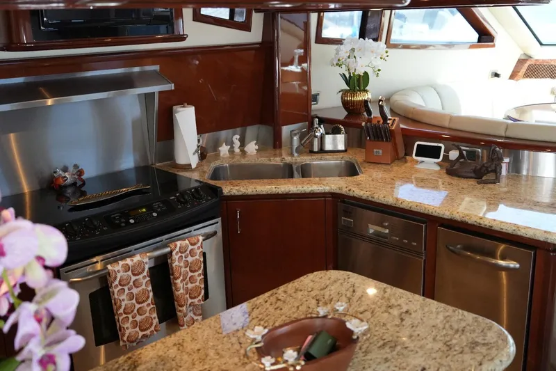 Slide: The Image of Luxurious kitchen interior of 2008 Marquis 65 Skylounge yacht with granite countertops and modern appliances. - 44