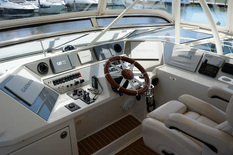 Slide: The Image of Cockpit of 2008 Marquis 65 Skylounge yacht with Garmin navigation systems and leather seating. - 35
