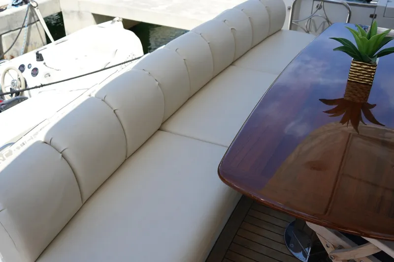 Slide: The Image of Luxurious seating area on a 2008 Marquis 65 Skylounge yacht with elegant table and decor. - 27