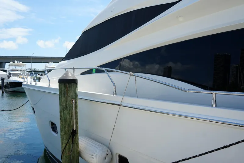 Slide: The Image of Luxury 2008 Marquis 65 Skylounge yacht docked at marina. - 3