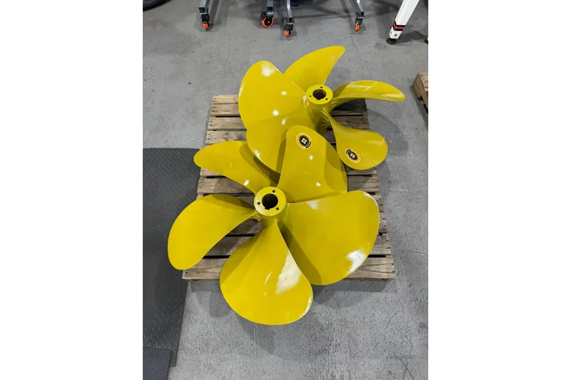Slide: The Image of Yellow boat propellers on a wooden pallet, suitable for 2008 Marquis 65 Skylounge. - 84