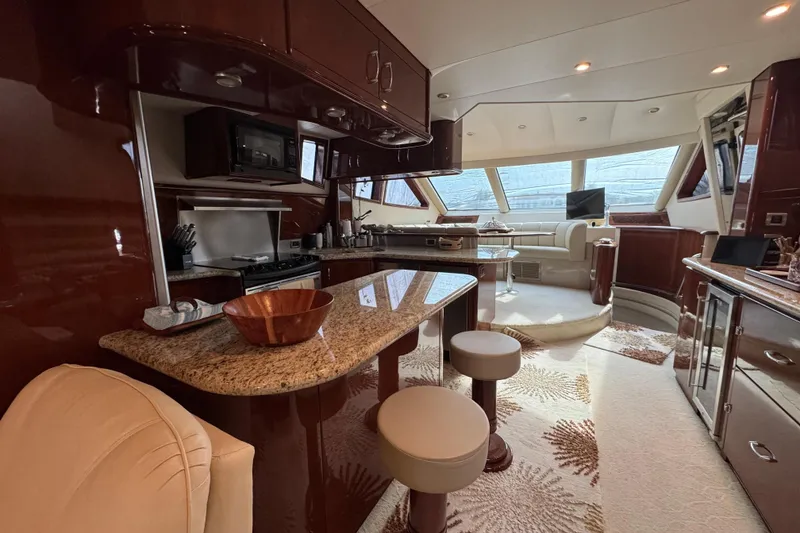 Slide: The Image of Luxurious interior of a 2008 Marquis 65 Skylounge yacht with elegant kitchen and seating area. - 7