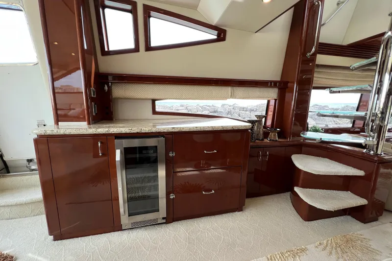 Slide: The Image of Luxurious interior of a 2008 Marquis 65 Skylounge yacht with elegant cabinetry and modern amenities. - 10