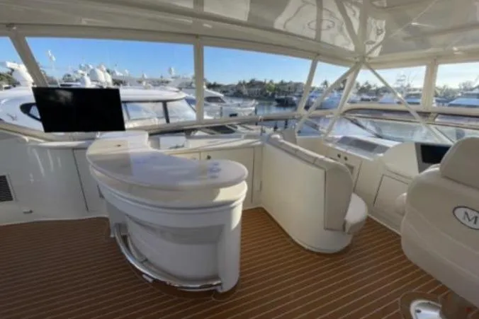 Slide: The Image of Luxurious interior of a 2008 Marquis 65 Skylounge yacht with elegant seating and panoramic views. - 29