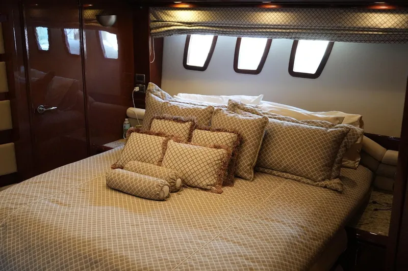 Slide: The Image of Luxurious bedroom interior of 2008 Marquis 65 Skylounge yacht with elegant bedding and cushions. - 59