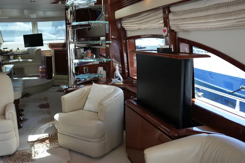 Slide: The Image of Luxurious interior of 2008 Marquis 65 Skylounge yacht with plush seating and modern amenities. - 12