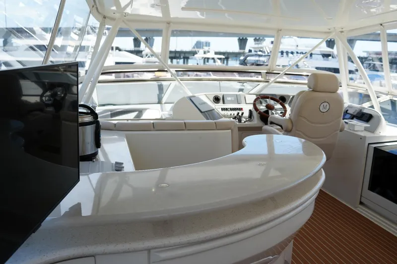 Slide: The Image of Luxurious interior of 2008 Marquis 65 Skylounge yacht with helm and seating area. - 31