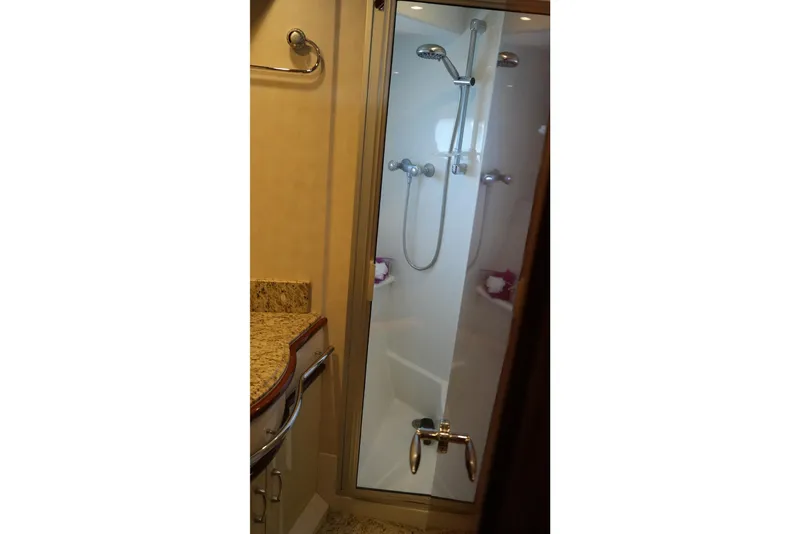 Slide: The Image of Shower area in 2008 Marquis 65 Skylounge yacht with granite countertop. - 70