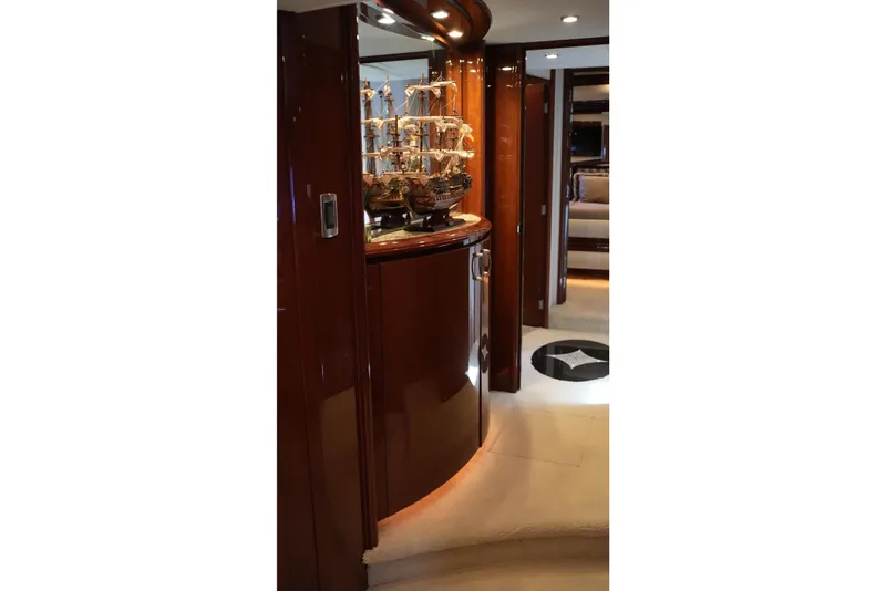 Slide: The Image of Luxurious interior of 2008 Marquis 65 Skylounge yacht with elegant wood finishes and model ship display. - 53