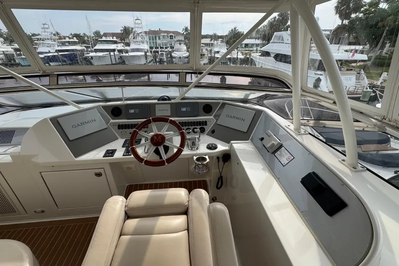 Slide: The Image of Helm of 2008 Marquis 65 Skylounge yacht with Garmin navigation systems and luxurious seating. - 34