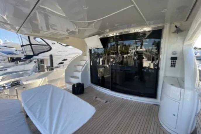 Slide: The Image of Luxurious 2008 Marquis 65 Skylounge yacht deck with sleek design and modern amenities. - 21