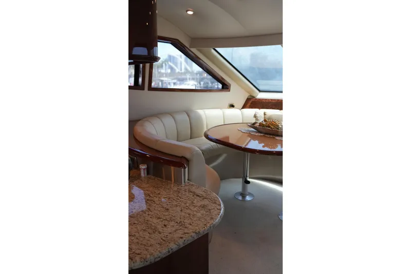 Slide: The Image of Luxurious interior of 2008 Marquis 65 Skylounge yacht with elegant seating and table. - 47