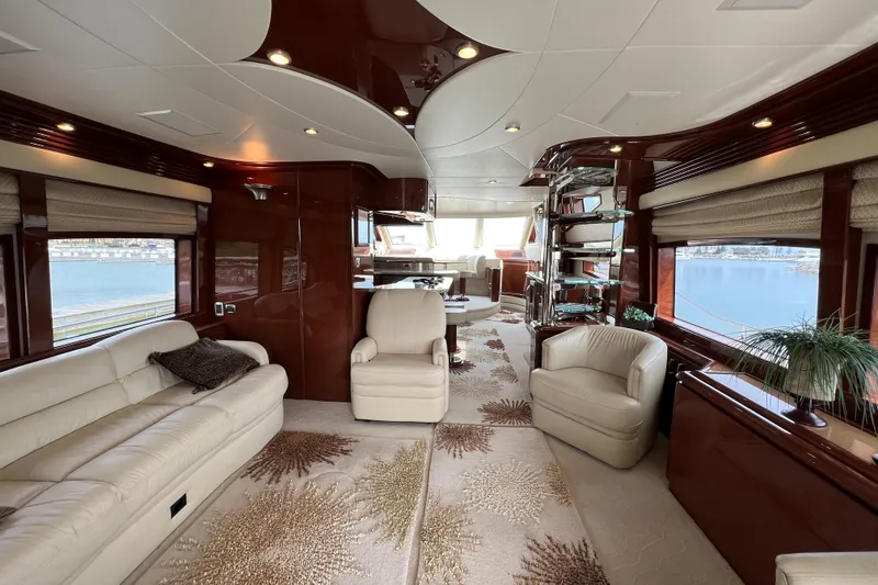 Slide: The Image of Luxurious interior of a 2008 Marquis 65 Skylounge yacht with elegant seating and panoramic windows. - 6
