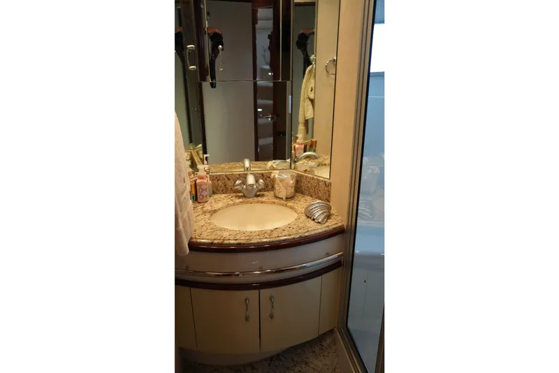 Slide: The Image of Luxurious bathroom vanity in 2008 Marquis 65 Skylounge yacht with granite countertop. - 69