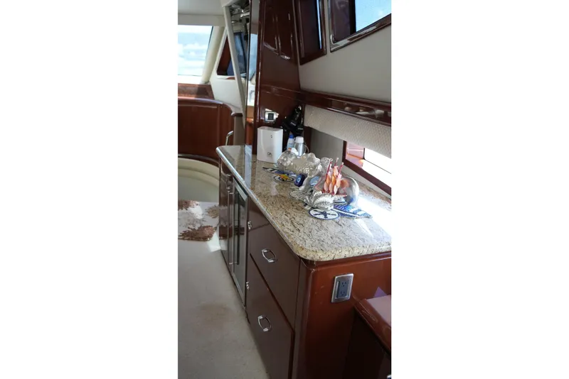 Slide: The Image of Luxurious interior of 2008 Marquis 65 Skylounge yacht with elegant countertop decor. - 8
