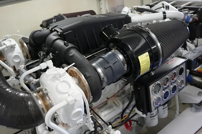 Slide: The Image of Engine of 2008 Marquis 65 Skylounge yacht, showcasing intricate mechanical components and gauges. - 78