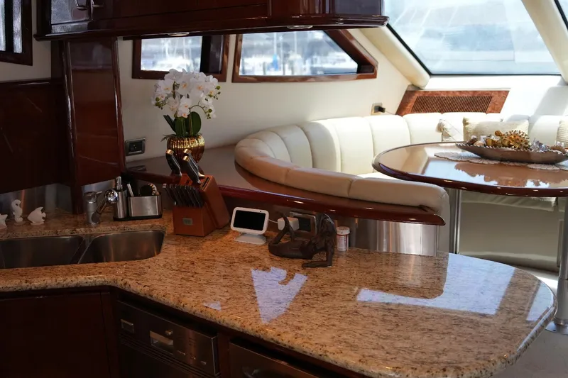 Slide: The Image of Luxurious interior of 2008 Marquis 65 Skylounge yacht with elegant kitchen and seating area. - 49
