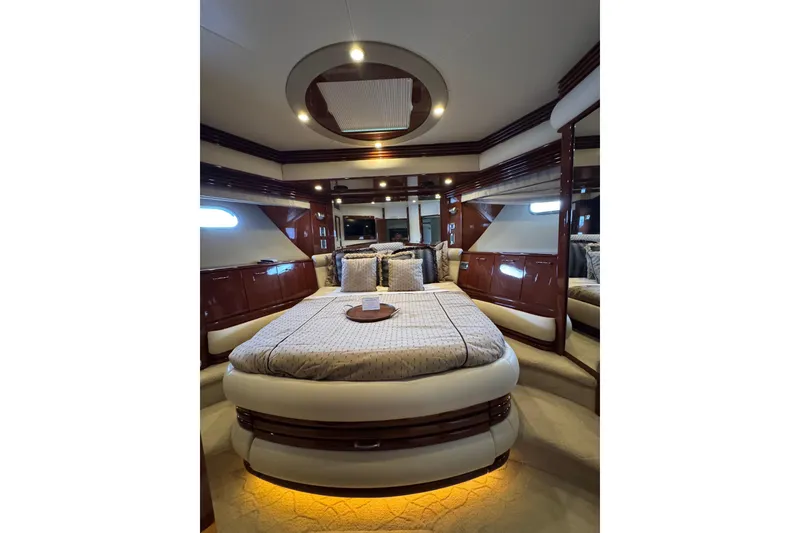 Slide: The Image of Luxurious bedroom interior of 2008 Marquis 65 Skylounge yacht with elegant wood finishes. - 57