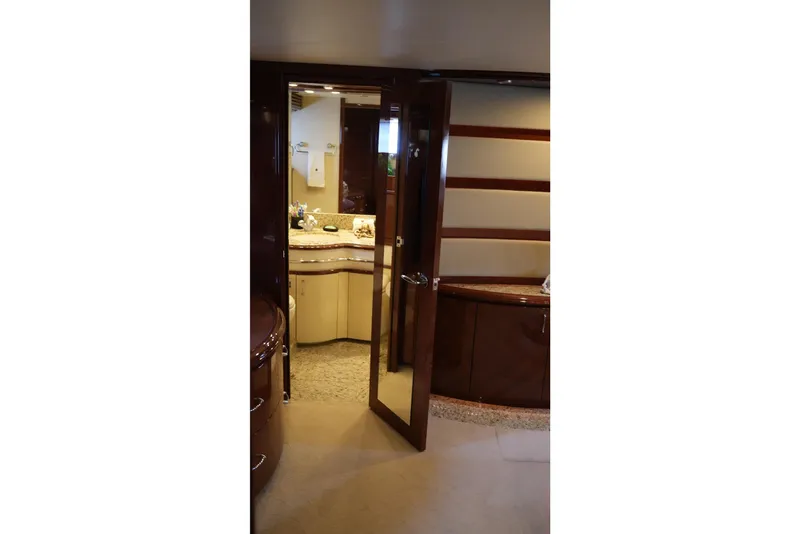 Slide: The Image of Luxurious interior of 2008 Marquis 65 Skylounge yacht, featuring elegant wood finishes and modern design. - 62