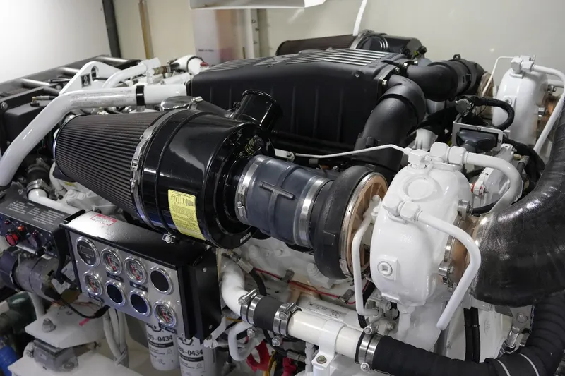 Slide: The Image of Engine room of 2008 Marquis 65 Skylounge yacht, showcasing detailed mechanical components. - 77