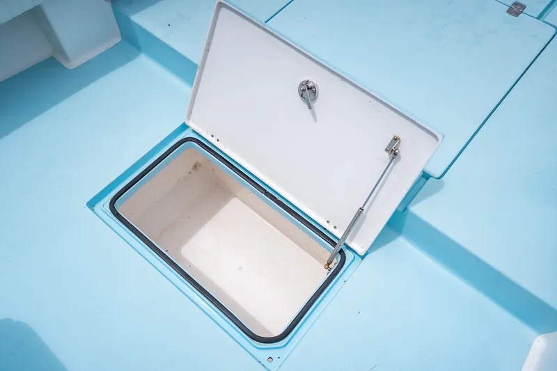 Slide: The Image of Open storage compartment on 2018 Dorado 25 SE boat deck. - 21