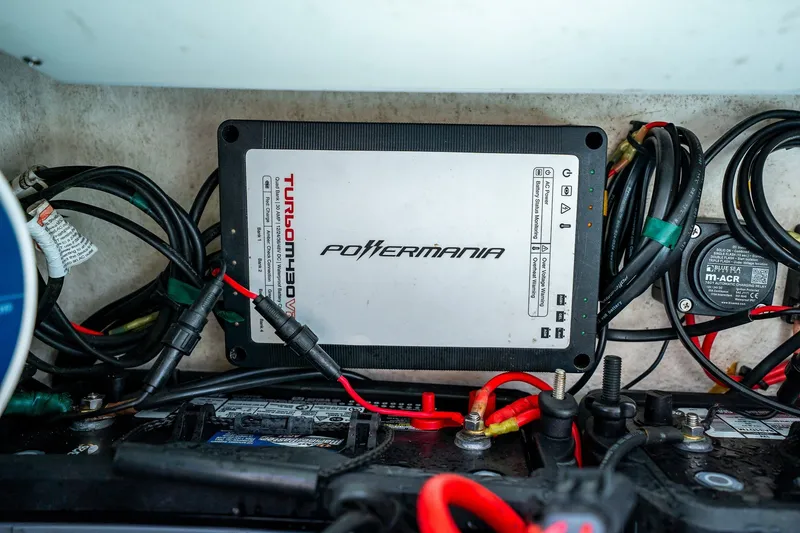 Slide: The Image of PowerMania Turbo M430V charger in 2018 Dorado 25 SE boat, surrounded by wiring. - 56
