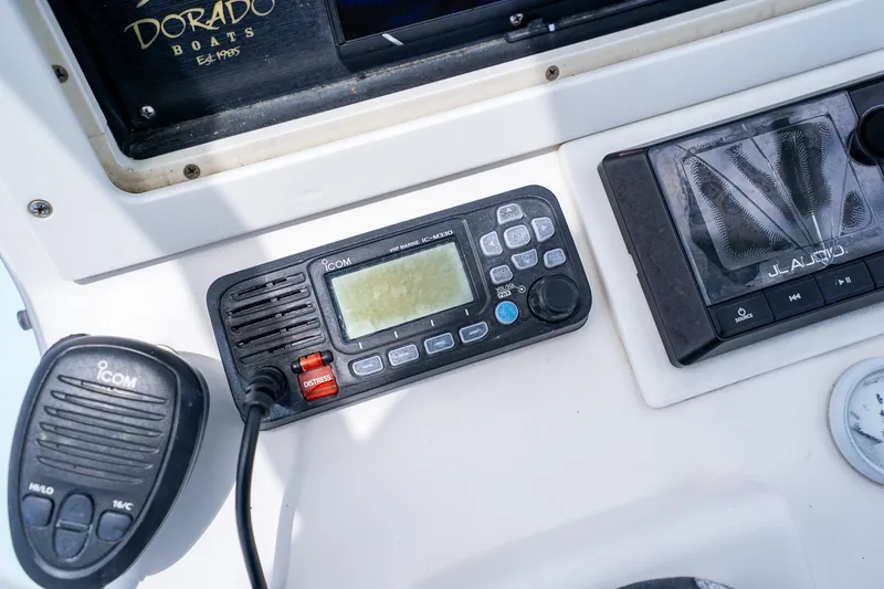 Slide: The Image of Control panel of a 2018 Dorado 25 SE boat with Icom marine radio. - 42