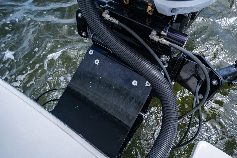 Slide: The Image of Close-up of 2018 Dorado 25 SE boat engine components on water. - 74