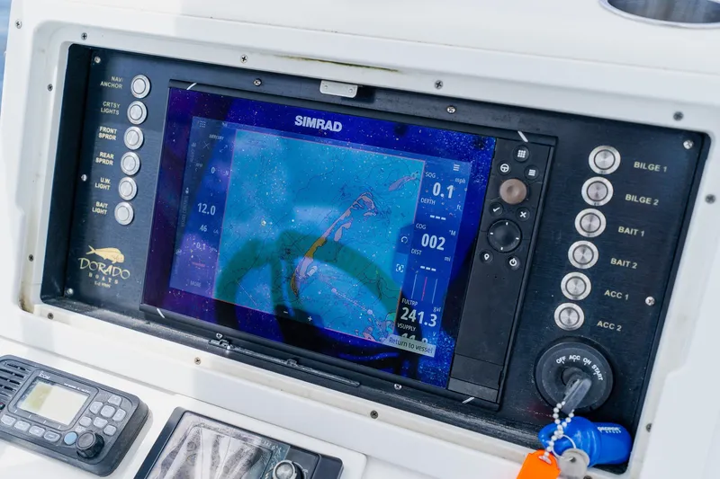 Slide: The Image of Control panel of a 2018 Dorado 25 SE boat with Simrad navigation display. - 40