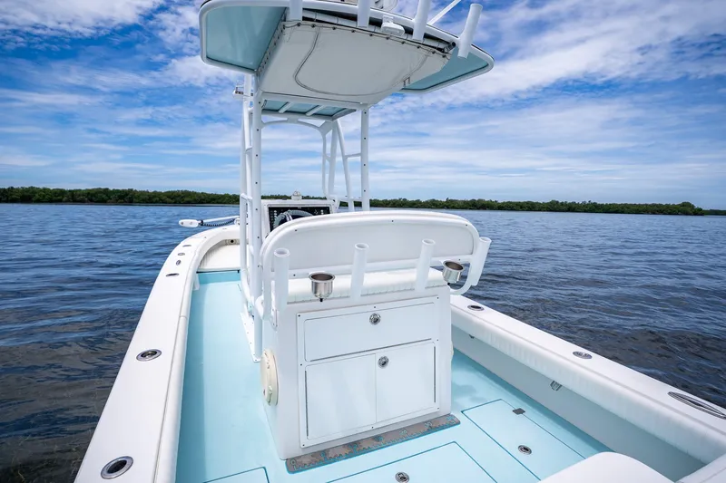 Slide: The Image of 2018 Dorado 25 SE boat on calm water under a blue sky. - 52