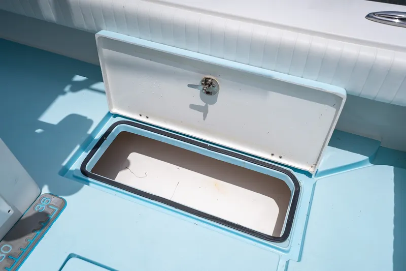 Slide: The Image of Open storage compartment on a 2018 Dorado 25 SE boat deck. - 65