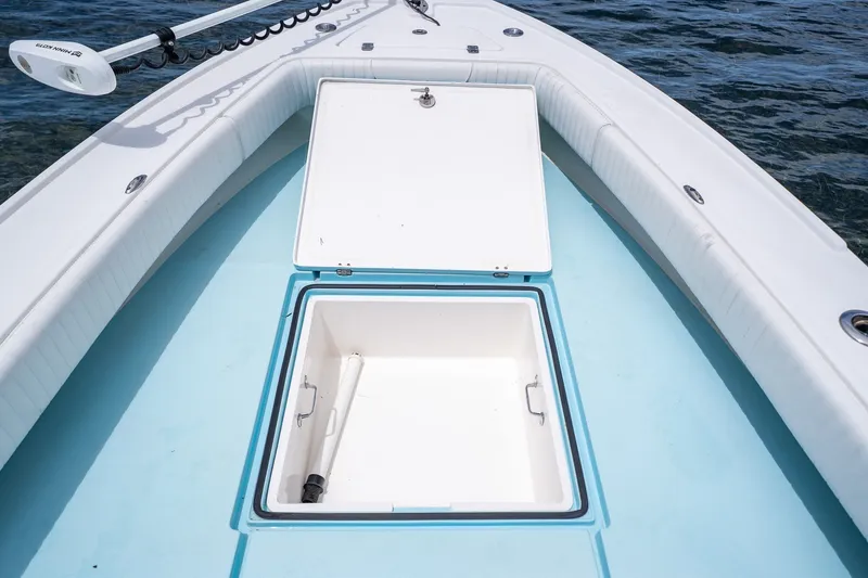 Slide: The Image of 2018 Dorado 25 SE boat with open storage compartment on deck. - 22